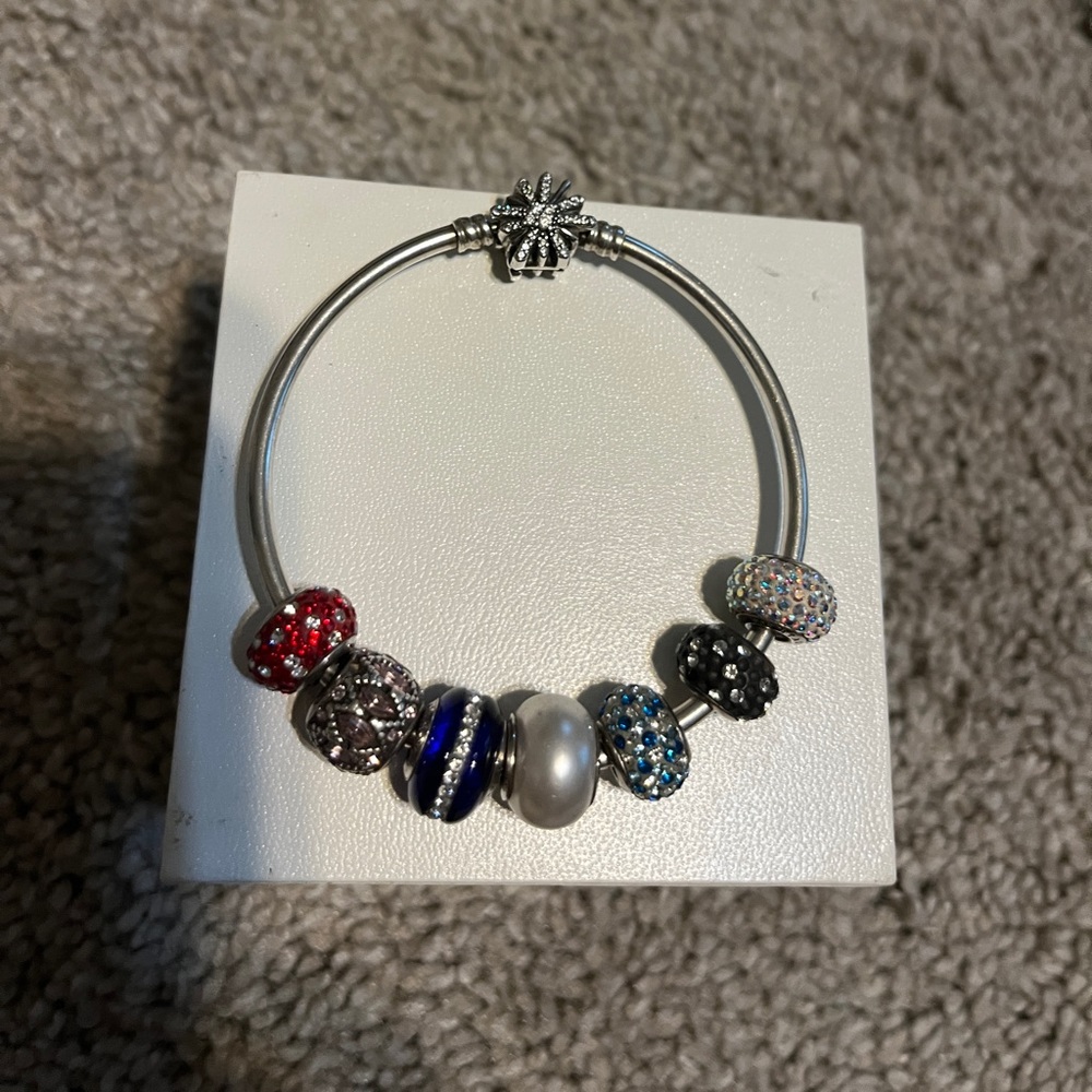 Kay’s bangle bracelet with seven charms
